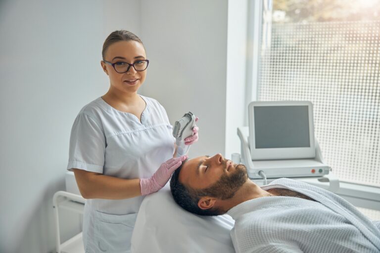 A medical professional performing a minimally invasive hair restoration procedure on a patient