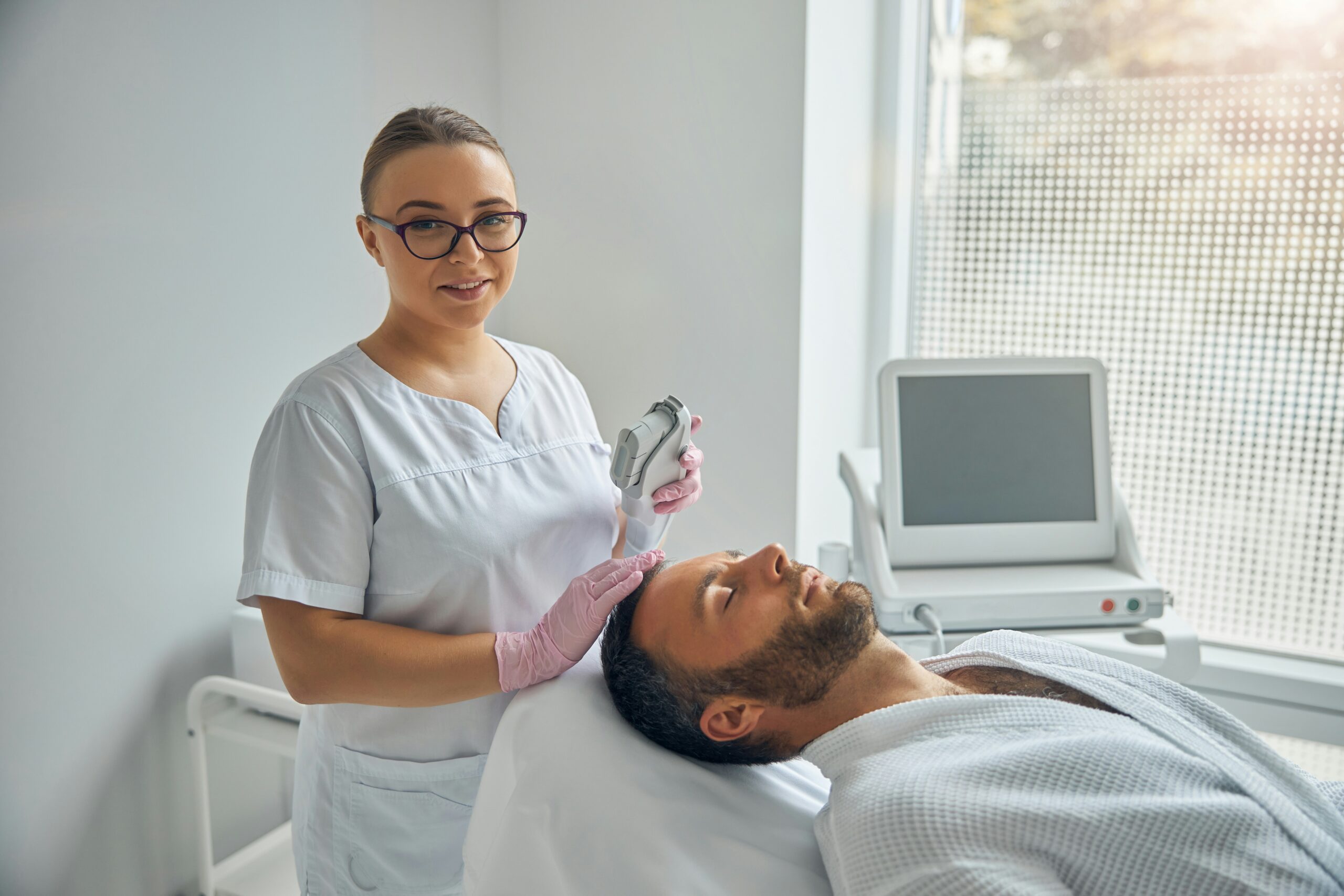 A medical professional performing a minimally invasive hair restoration procedure on a patient
