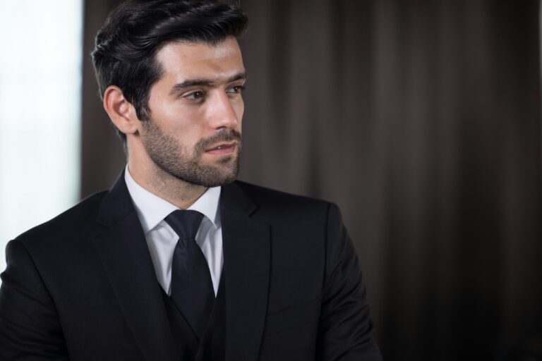 A distinguished man with a refreshed, natural appearance, demonstrating the successful results of male blepharoplasty.